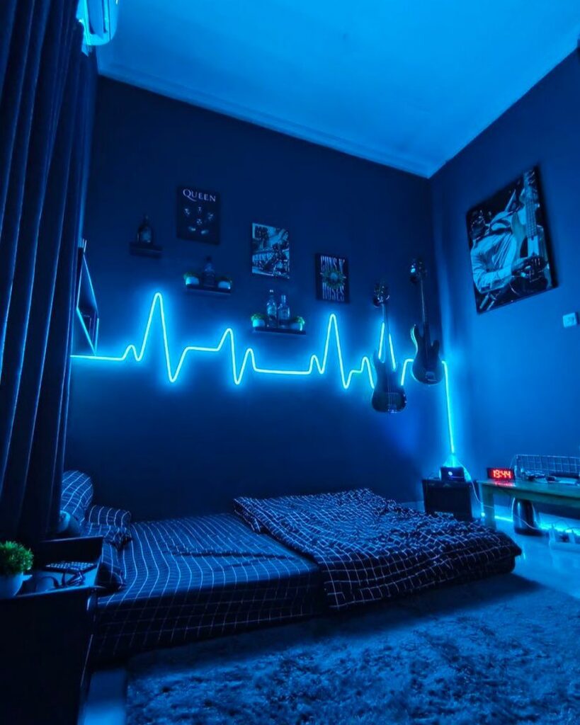 Blue neon heartbeat light glowing on a dark bedroom wall above a bed.