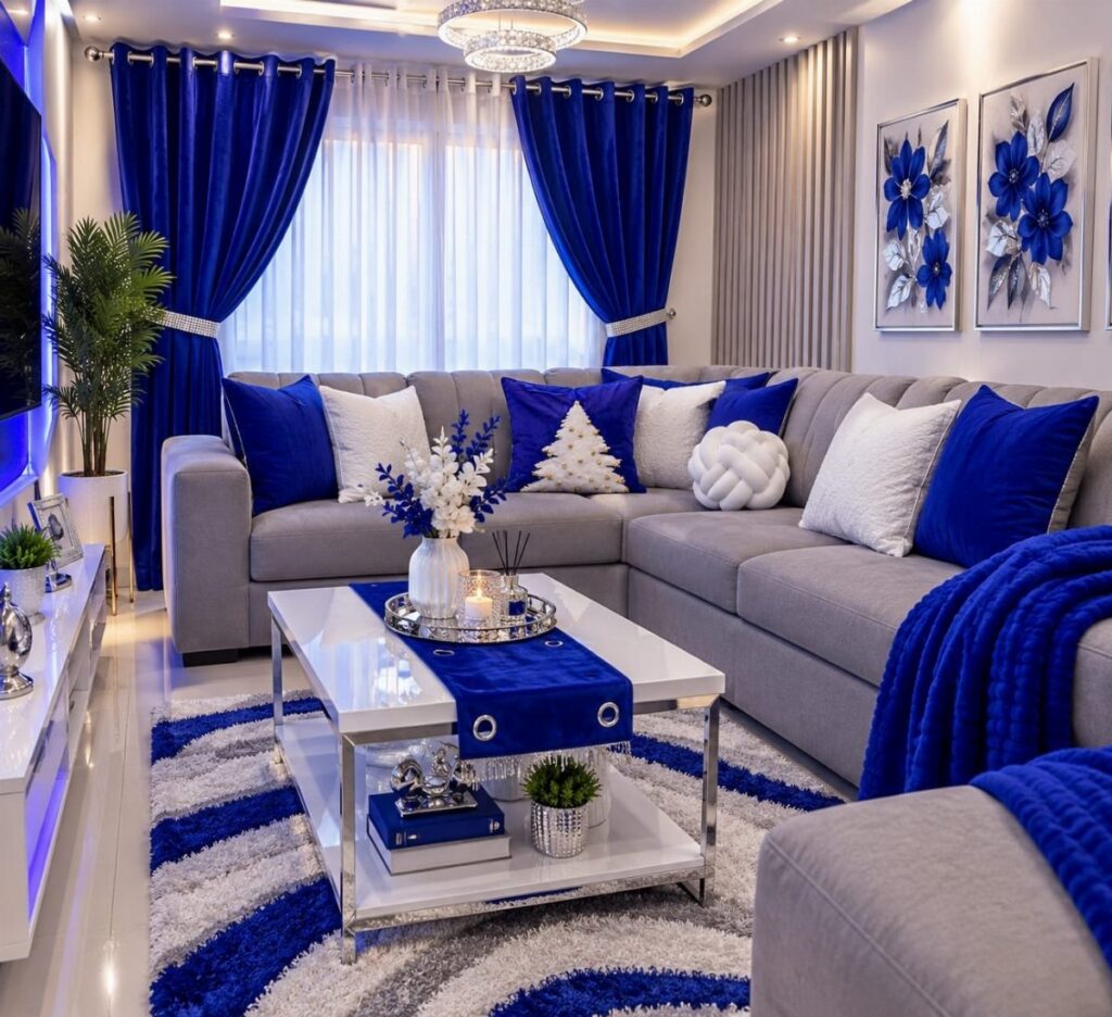Grey sectional sofa with blue and white pillows in a blue themed living room.