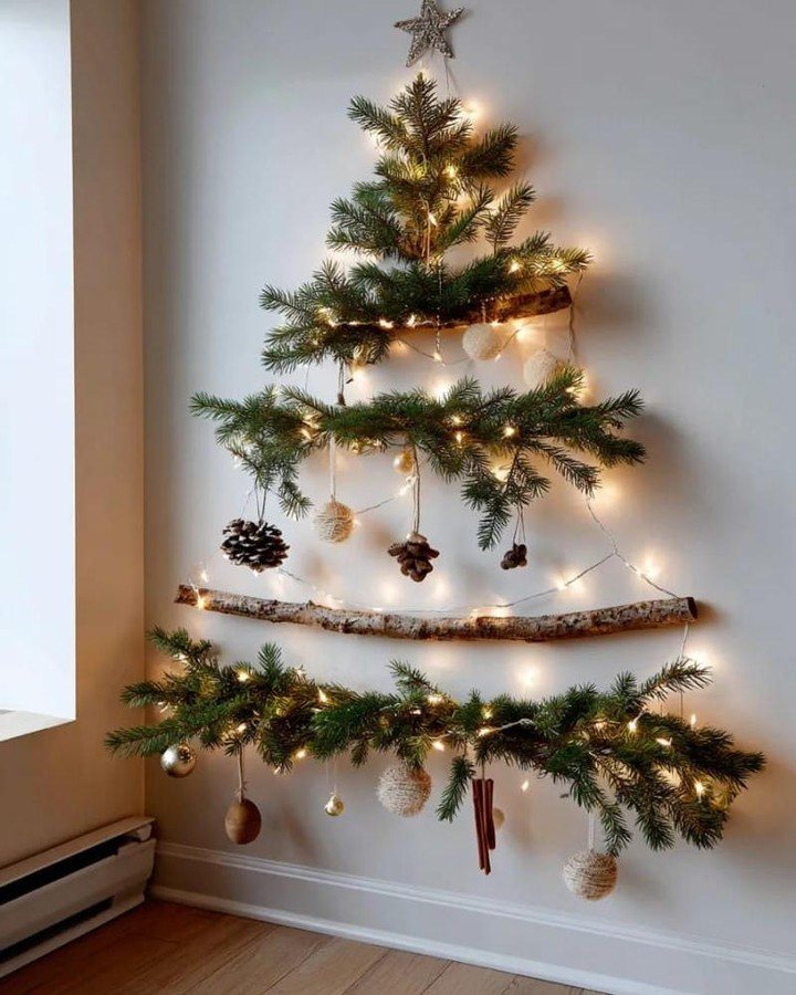 A minimalist boho Christmas tree made of birch branches, pine greenery, and warm fairy lights.